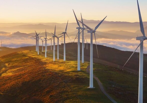 Wind farm on a hill above a sea of clouds